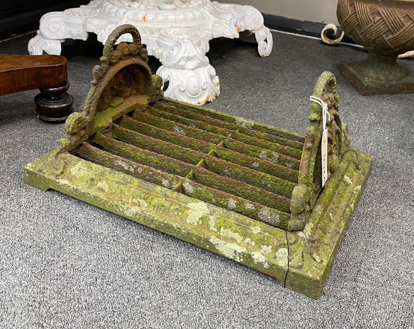 A Victorian cast iron boot scraper, width 46cm, depth 33cm